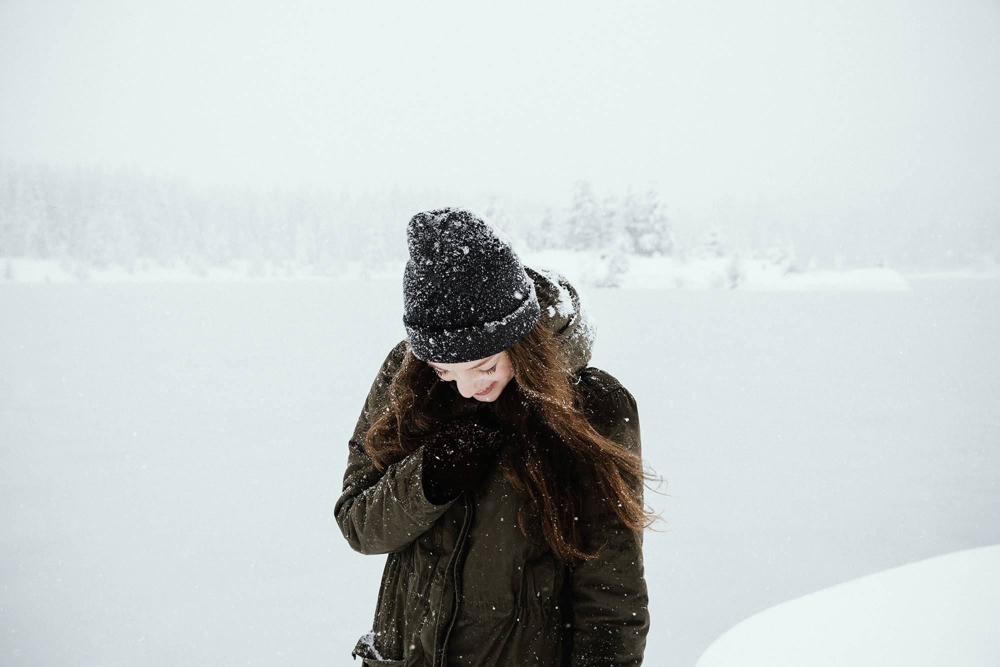 A girl during a strom, shows how to prepare for a canadian winter trip.