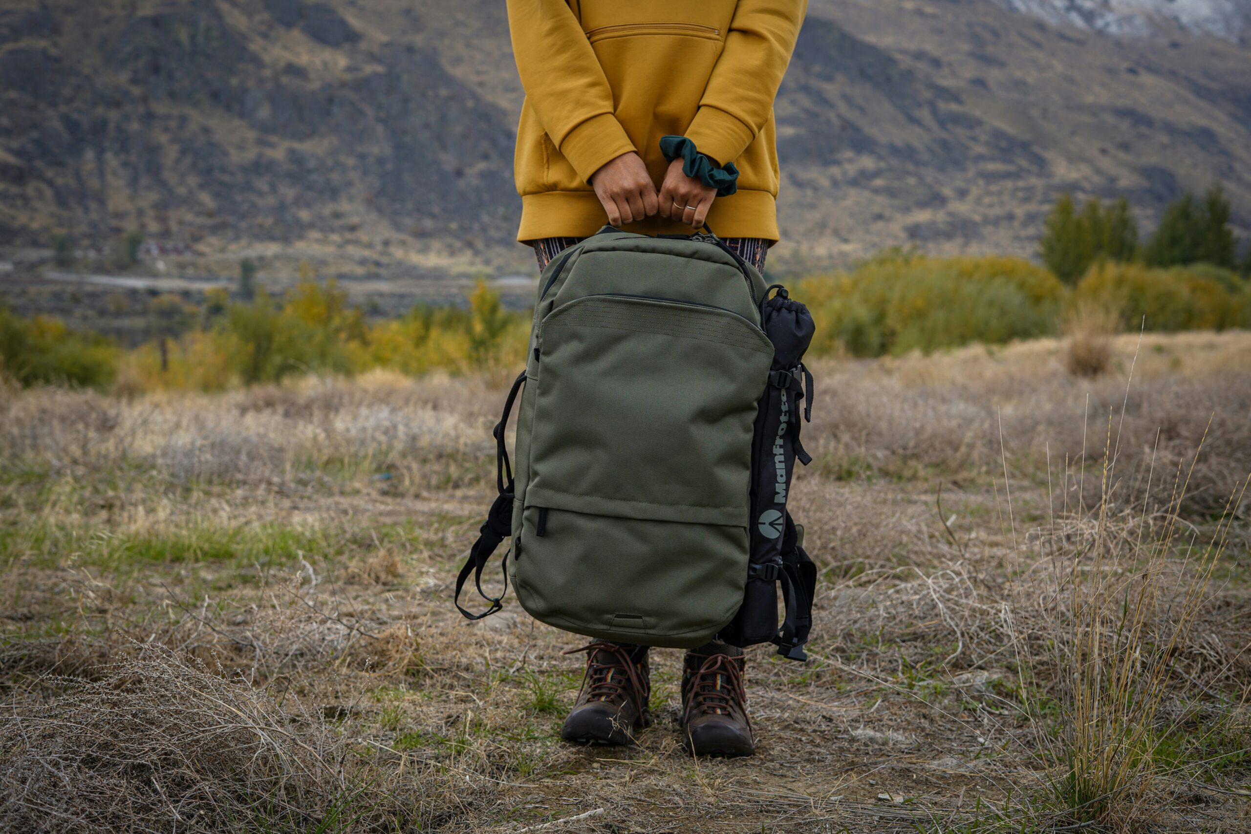a person holding luggage. It represent luggage and flight insurance.